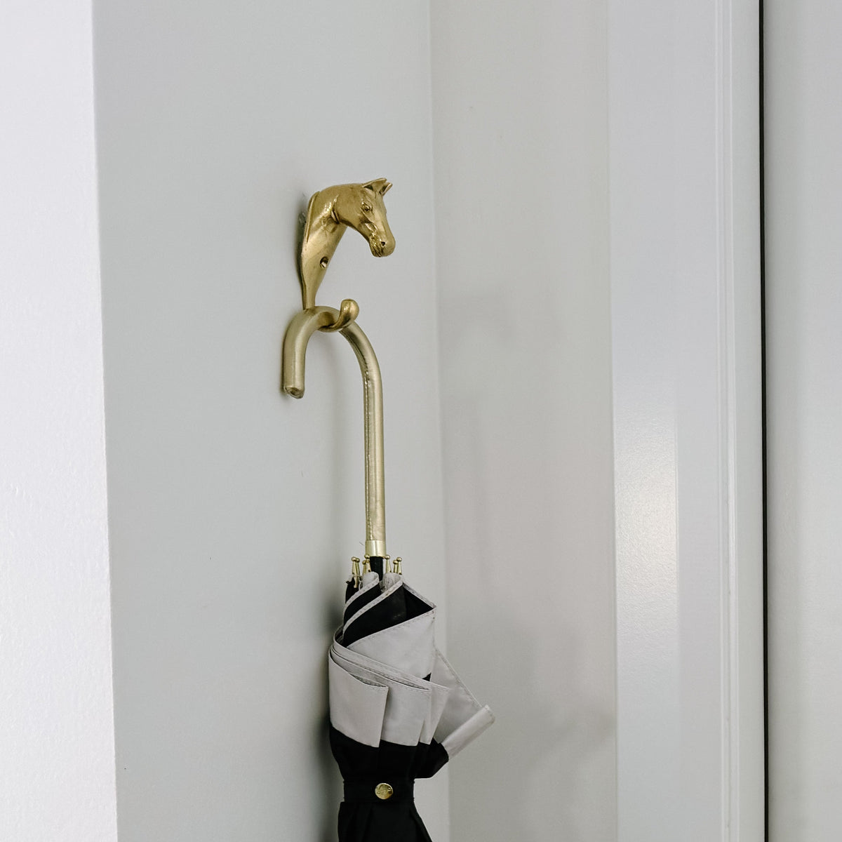 Solid Brass Equestrian Hook styled in Teresa’s home